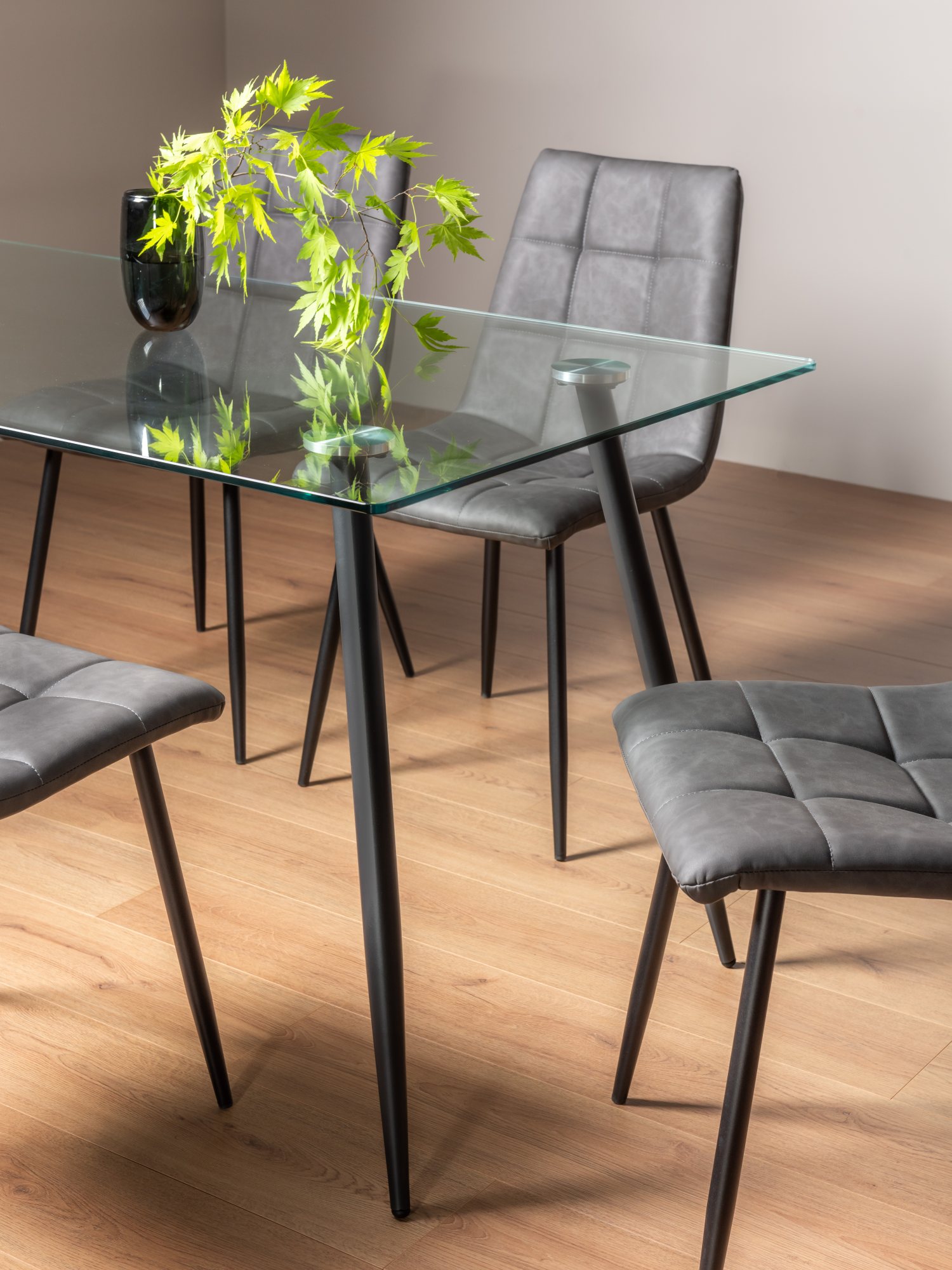 Martini Clear Glass 6 Seater Table & 6 Mondrian Dark Grey Faux Leather Chairs by Bentley Designs | Style Our Home