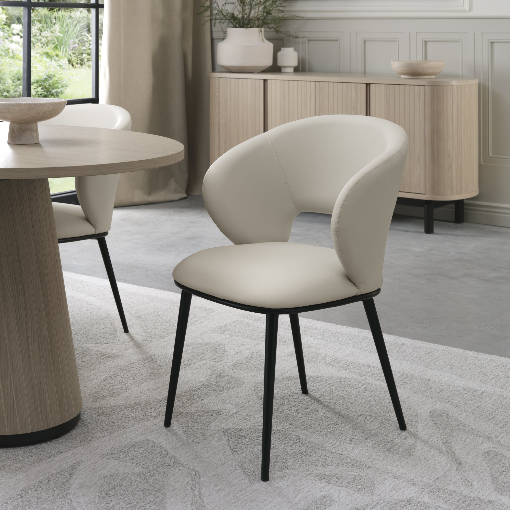 Luca - Ivory Faux Leather Chair with Matt Black Legs (Pair) by Bentley Designs | Style Our Home