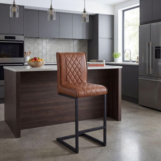 Ainslvell Tuscan Tan Leather Effect Cross Stitch Bar Stool with Black Metal Frame by Shankar | Style Our Home