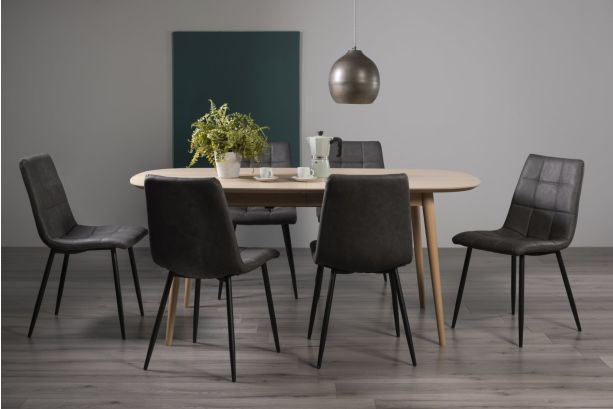 Dansk Scandi Oak 6-8 Seater Dining Table & 6 Mondrian Dark Grey Faux Leather Chairs with Sand Black Powder Coated Legs - Style Our Home